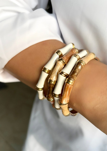 بنگل و دستبند زنانه سفید و طلایی